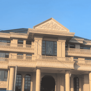 新疆黄金麻别墅外墙干挂石材效果示例